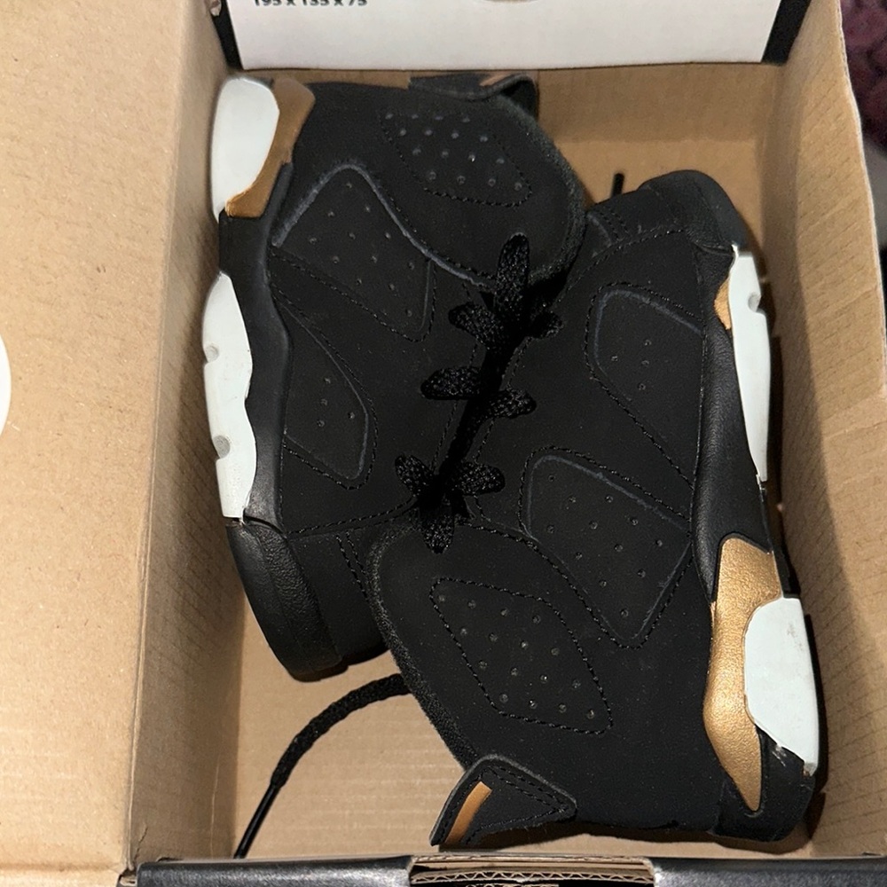 Jordan Retro DMP Black and Gold Sneakers